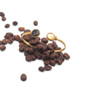 Bracciale rigido con polvere di caffè e foglia dorata