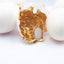 Anello in resina regolabile con guscio d'uovo bianco e foglia dorata