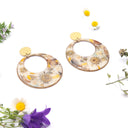 Orecchini a cerchio con fiori primaverili