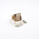 An adjustable brass ring with marine elements and polystyrene