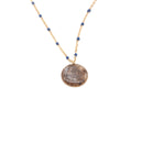 collana con ciondolo in resina e sabbia