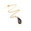 Collana con ciondolo realizzato con fuliggine e foglie d'oro