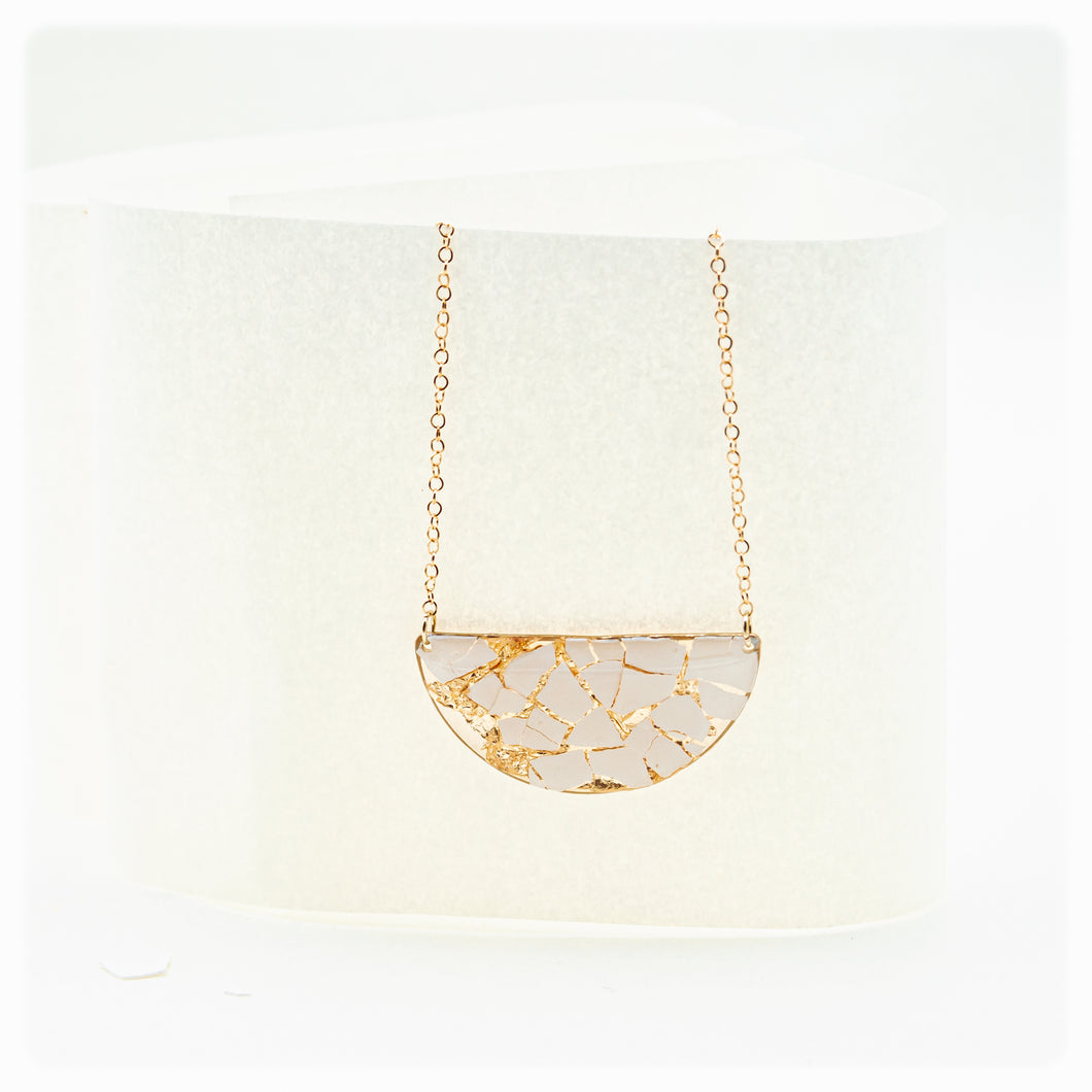 Half moon necklace with white eggshell and gold leaf