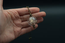 Load image into Gallery viewer, Long necklace with glass pendant and shower heads and gold leaves
