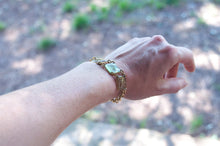 Load image into Gallery viewer, Adjustable brass bracelet with sand and plastic charms
