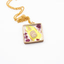 Necklace with resin pendant featuring natural and polluting marine elements