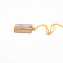 Resin pendant necklace with natural and polluting marine elements