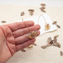 Load image into Gallery viewer, Half moon pendant earrings with butcher&#39;s leaf and gold fragments
