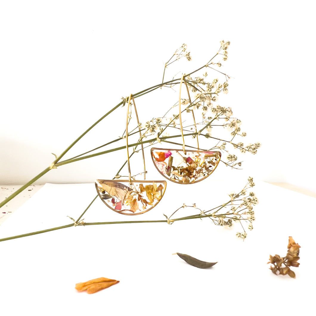 Half moon drop earrings with flower cutouts and gold fragments